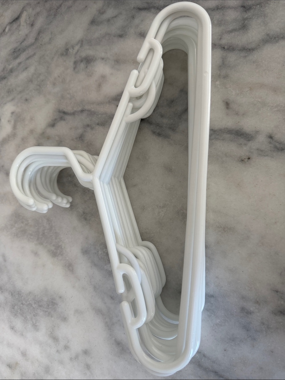 13 White Plastic baby hangers